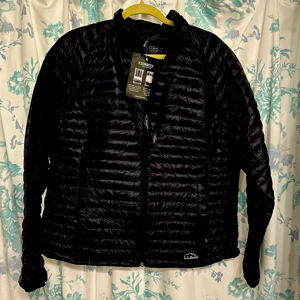 A brand new black jacket .